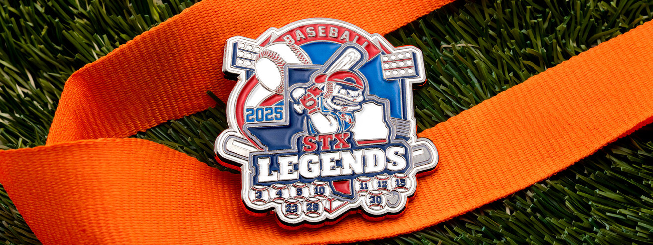 STX Legends 2025 baseball trading pin with a batter on a red, white and blue diamond and player numbers along the bottom, on an orange ribbon over turf